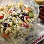 Greek Chicken Pasta Salad ~ marinated chicken, juicy tomatoes, crunchy cucumbers, artichoke hearts, Kalamata olives, and feta cheese are tossed with corkscrew pasta and a tangy dressing in this colorful, flavorful recipe that's perfect for summer barbecues and get-togethers! | FiveHeartHome.com