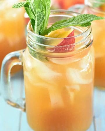 Minty Peach Tea Punch ~ a festive sparkling beverage of mint-infused tea mixed with fresh peach nectar, simple syrup, ginger ale, and club soda, perfect for spring or summer showers, barbecues, and parties! | FiveHeartHome.com