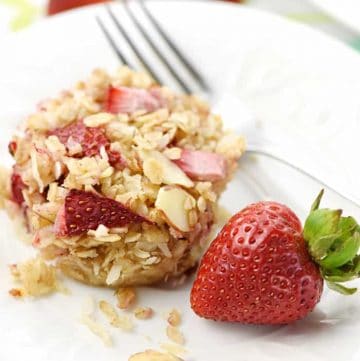 Strawberry Baked Oatmeal Cups ~ loaded with chewy oats, crunchy almonds, sweet coconut, and fresh diced strawberries, this wholesome, perfectly-portioned breakfast is ideal to make ahead of time and reheat in the morning! | FiveHeartHome.com