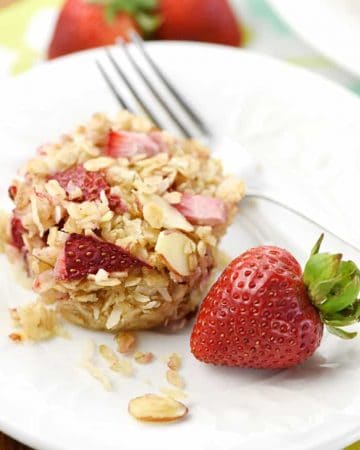 Strawberry Baked Oatmeal Cups ~ loaded with chewy oats, crunchy almonds, sweet coconut, and fresh diced strawberries, this wholesome, perfectly-portioned breakfast is ideal to make ahead of time and reheat in the morning! | FiveHeartHome.com