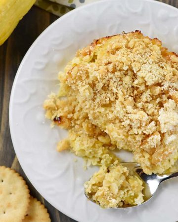 Aerial view of Squash Casserole on plate with spoon.