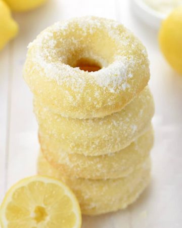 Lemon Sugar Baked Donuts ~ light, citrusy, and generously coated in a crunchy, lemon-zest infused sugar...the perfect sunny treat for breakfast or dessert! | FiveHeartHome.com