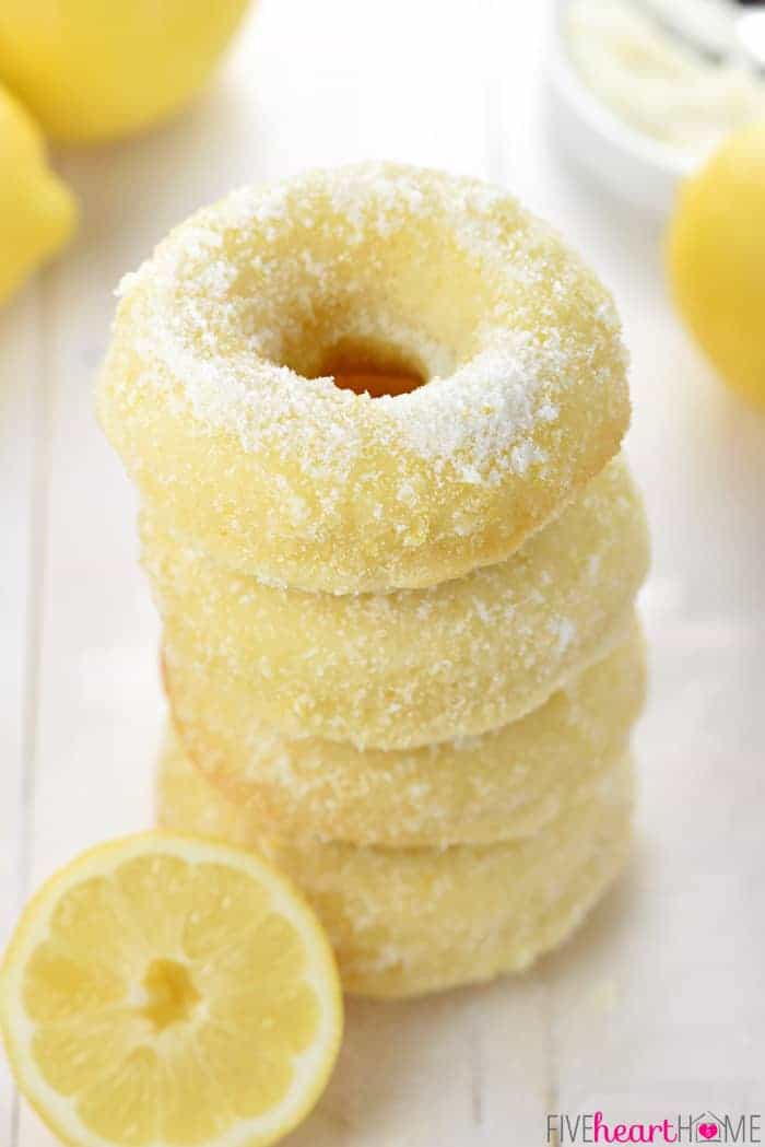 Lemon Sugar Baked Donuts ~ light, citrusy, and generously coated in a crunchy, lemon zest-infused sugar...the perfect sunny treat for breakfast or dessert! | FiveHeartHome.com Stack of baked donuts.