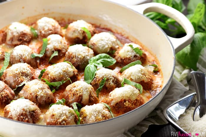 Parmesan Meatball Skillet ~ this easy-to-make, family-pleasing ground beef recipe features tender baked meatballs simmered in marinara and smothered with cheese, delicious served over pasta or piled on meatball subs! | FiveHeartHome.com