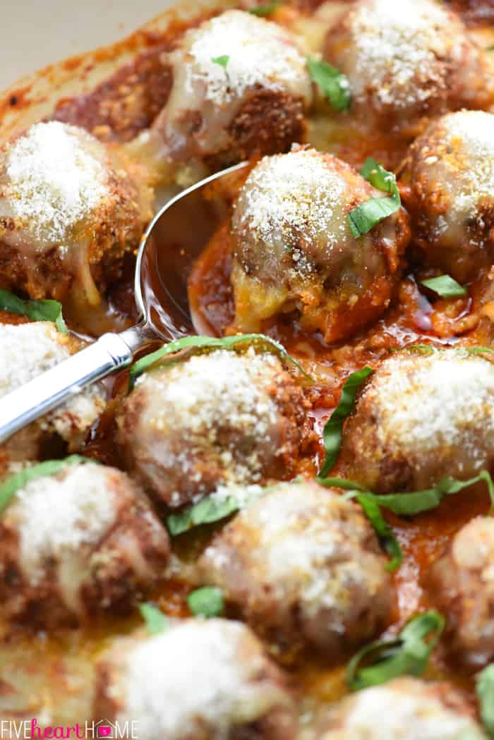 Close-up of Parmesan Meatballs with Parmesan and fresh basil.