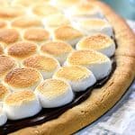 Peanut Butter Cookie S'mores Pizza ~ melted chocolate and toasted marshmallows top a thick, chewy, homemade peanut butter crust in this fun and decadent dessert recipe that's perfect for summer parties or year-round special occasions! | FiveHeartHome.com