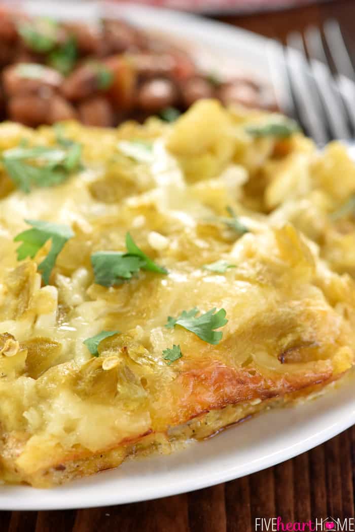 Close-up of Chicken Enchilada Casserole with golden edges.