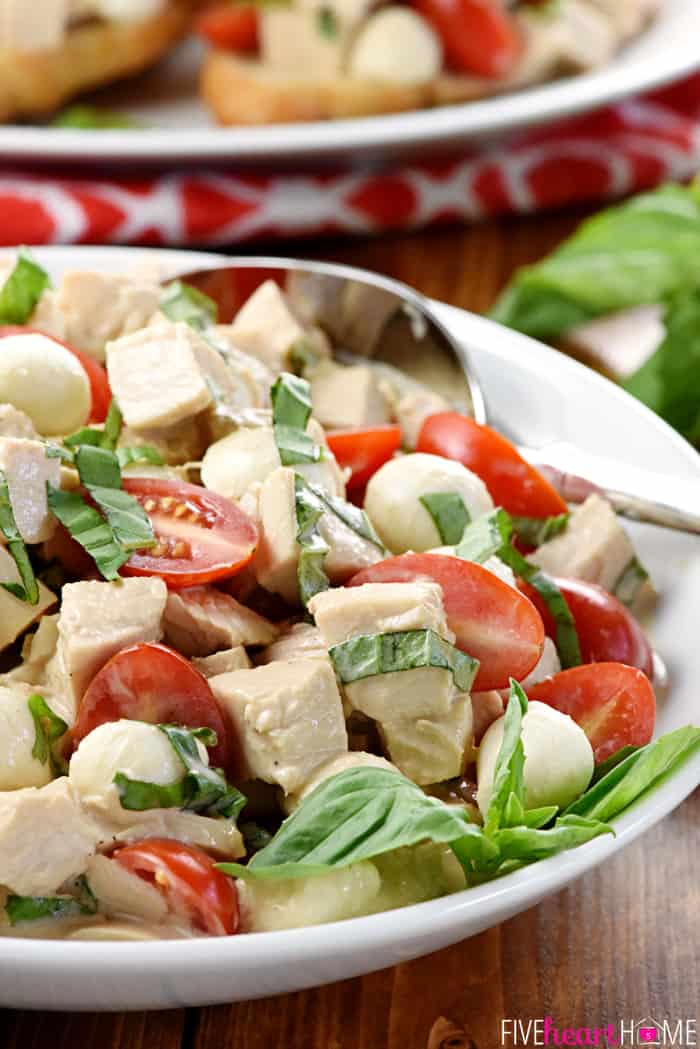 Caprese Chicken Salad ~ combines two summertime favorites, featuring juicy tomatoes, creamy mozzarella, and fresh basil tossed with diced chicken in a homemade, Greek yogurt-based balsamic dressing! | FiveHeartHome.com