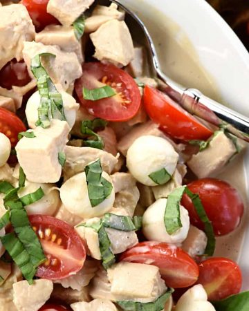 Caprese Chicken Salad ~ combines two summertime favorites, featuring juicy tomatoes, creamy mozzarella, and fresh basil tossed with diced chicken in a homemade, Greek yogurt-based balsamic dressing! | FiveHeartHome.com