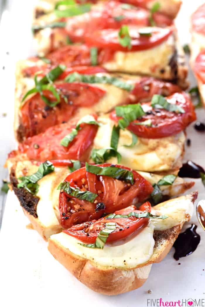 Close-Up of Caprese French Bread Pizza Cut Into Triangle Wedges 