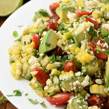 Corn Tomato Avocado Salad on white platter.