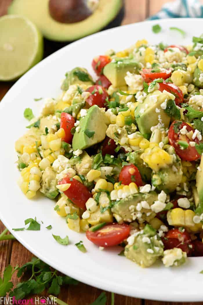 Corn Tomato Avocado Salad on white platter.