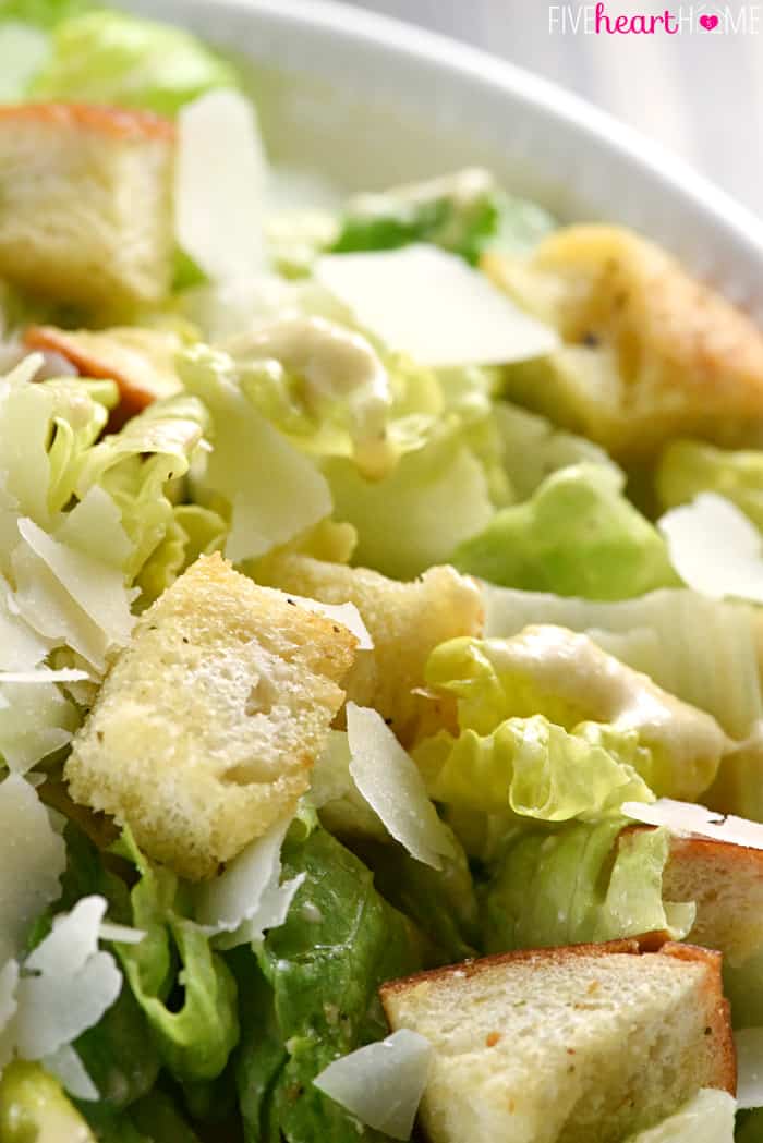 Close-up of lettuce, Parmesan, and croutons in bowl