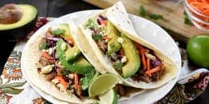 Slow Cooker Honey Lime Pulled Pork Tacos (or Nachos)