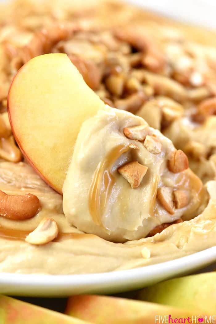 Caramel Apple Cheesecake Dip Scooped Up on an Apple Wedge 