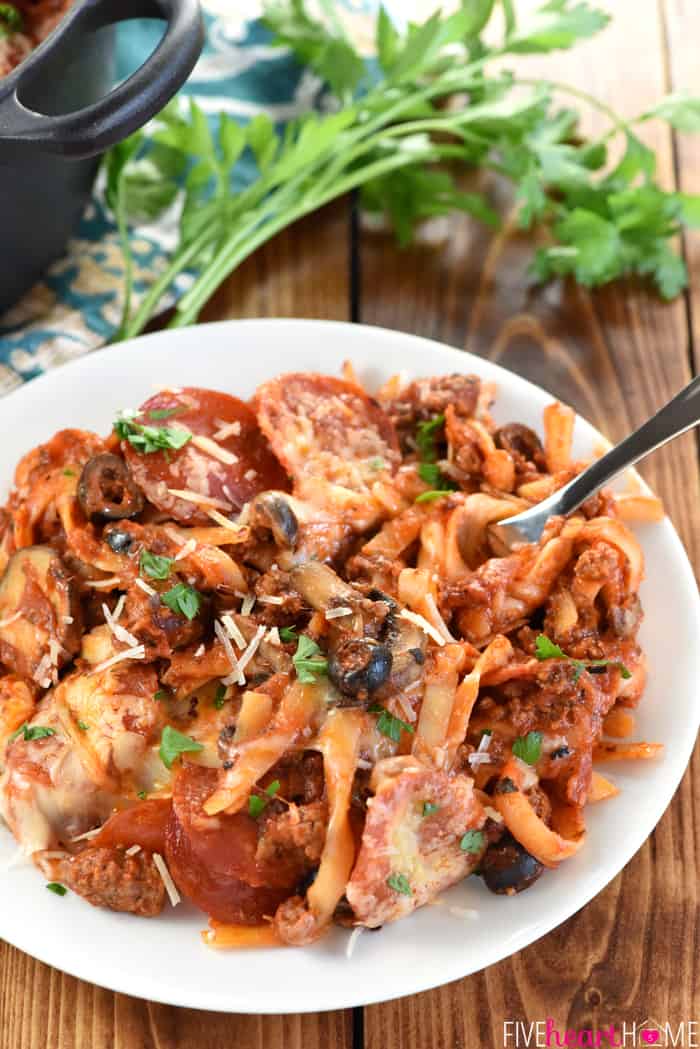 One-Pot Pizza Pasta ~ an easy, cheesy, comforting dinner recipe loaded with flavor thanks to all of your favorite pizza toppings...and as a bonus, everything gets cooked in the same pot! | FiveHeartHome.com Pizza Pasta on a white plate.