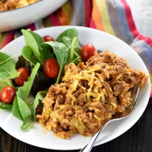 Homemade Taco Hamburger Helper on plate with salad.