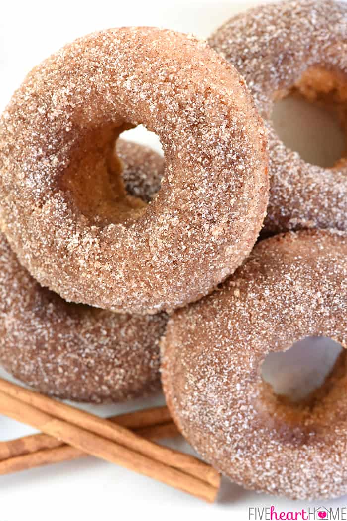 Close-up of Baked Apple Cider Donuts coated in cinnamon sugar.