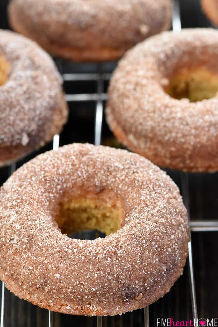 Baked Apple Cider Donuts cooling on a rack.