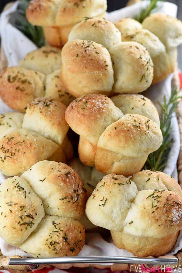 Basket of Cloverleaf Rolls sprinkled with rosemary and garlic salt.