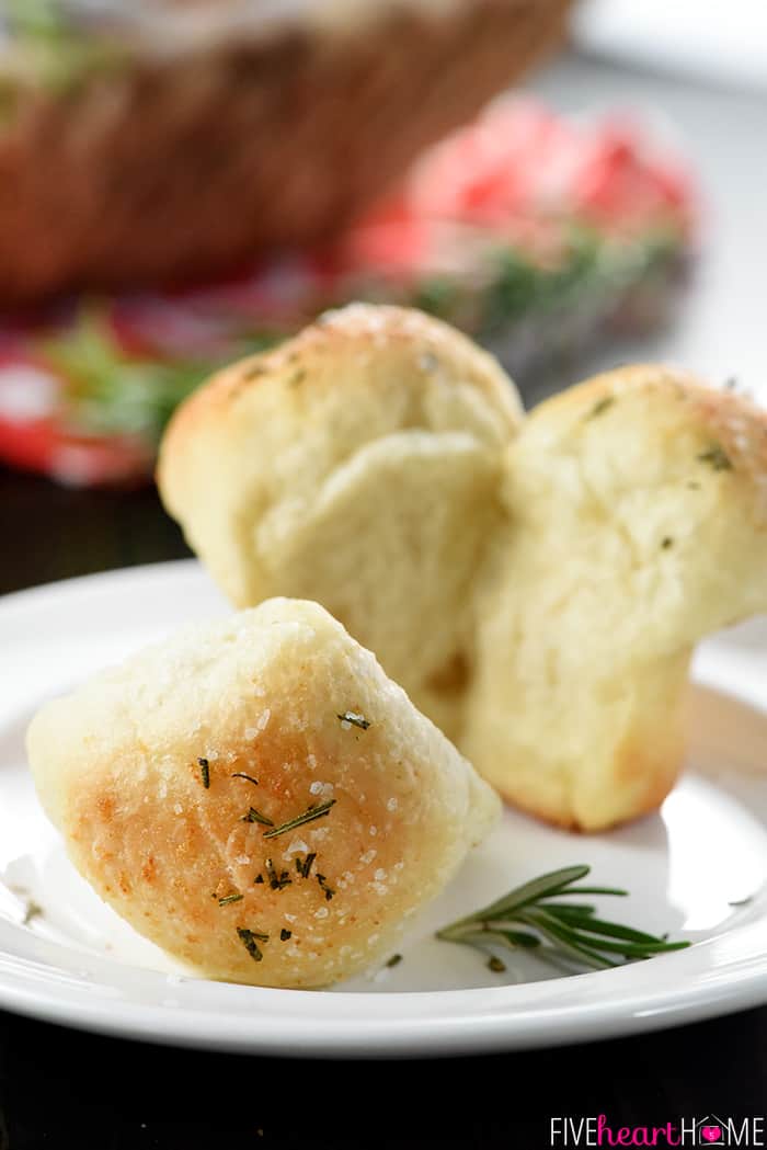 Pulled apart on a plate with rosemary garnish.