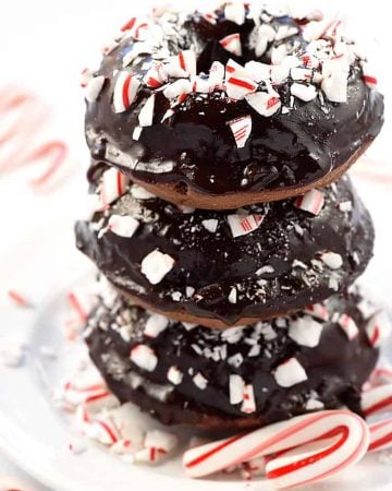 Chocolate Peppermint Baked Donuts ~ a decadent holiday breakfast or dessert, these baked donuts are soft and tender, with a rich chocolate glaze and crushed candy canes sprinkled on top! | FiveHeartHome.com
