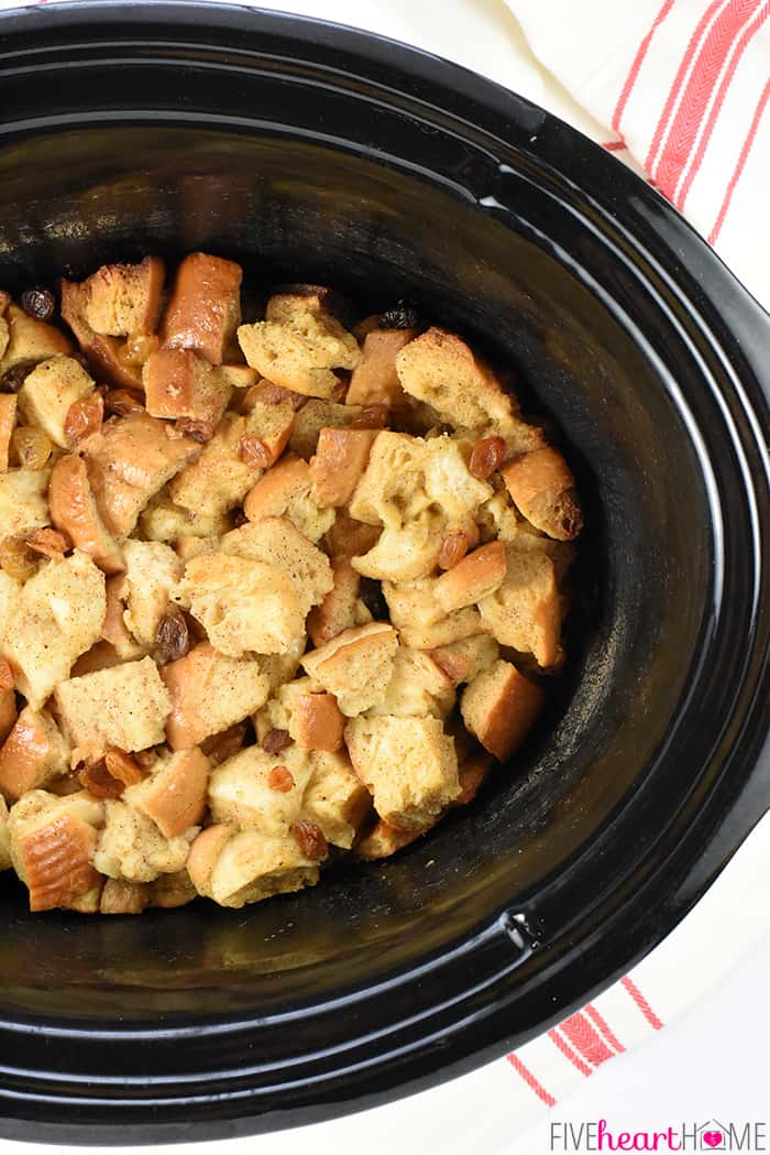 Slow Cooker Eggnog Bread Pudding ~ this decadent holiday breakfast, brunch, or dessert is studded with golden raisins, sprinkled with nutmeg, and drizzled with a silky eggnog syrup...and it effortlessly cooks up in the crock pot, freeing up the oven for other recipes! | FiveHeartHome.com Eggnog Bread Pudding in Slow Cooker