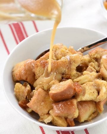 Slow Cooker Eggnog Bread Pudding ~ this decadent holiday breakfast, brunch, or dessert is studded with golden raisins, sprinkled with nutmeg, and drizzled with a silky eggnog syrup...and it effortlessly cooks up in the crock pot, freeing up the oven for other recipes! | FiveHeartHome.com