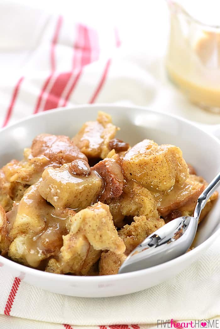 Close-Up of Slow Cooker Eggnog Bread PuddingIn White Bowl with Spoon 