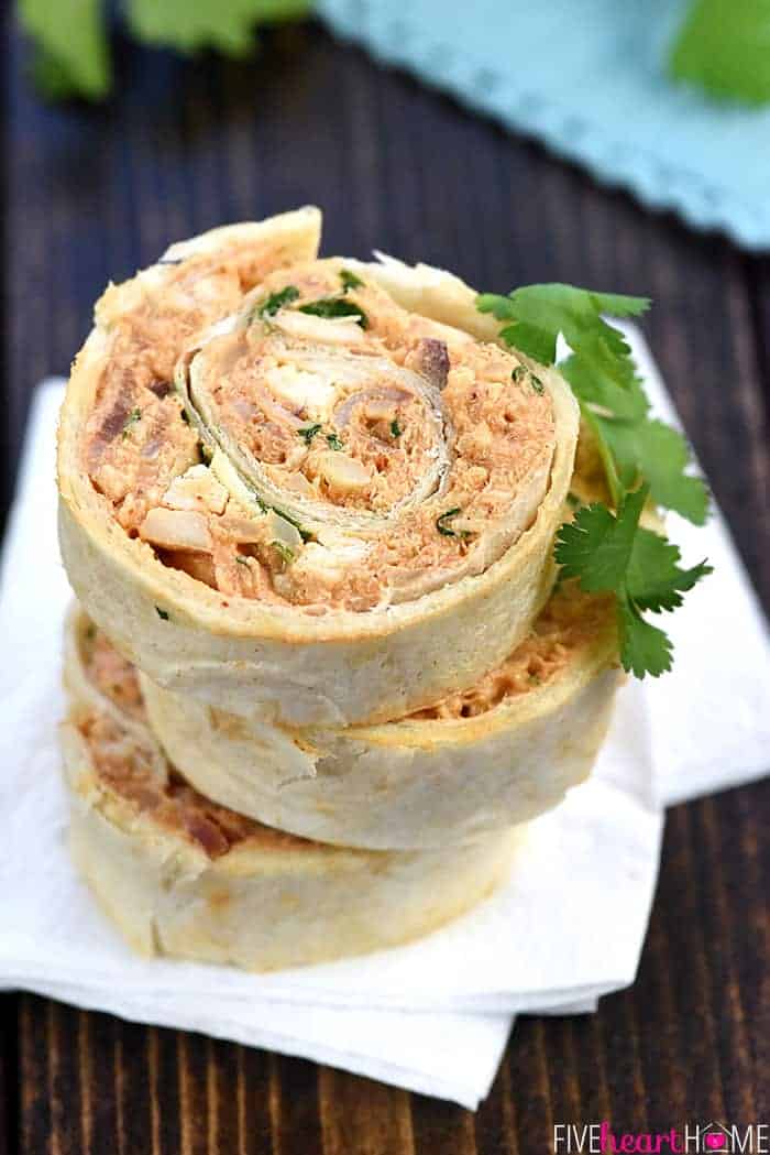 BBQ Chicken Tortilla Pinwheels ~ soft flour tortillas are slathered with a mixture of cream cheese, mozzarella, chicken, bacon, barbecue sauce, red onion, and cilantro, then rolled up tight and sliced in this flavorful, addictive appetizer recipe that's perfect for parties, potlucks, picnics, or game day! | FiveHeartHome.com