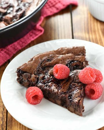 Raspberry Swirl Brownies ~ fudgy brownies are studded with chocolate chips, topped with raspberry preserves, and sliced into wedges in this rich, decadent dessert, perfect for Valentine's Day or as an anytime sweet treat! | FiveHeartHome.com
