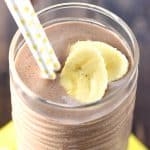 Close-up of Chocolate Banana Smoothie with straws and garnish.