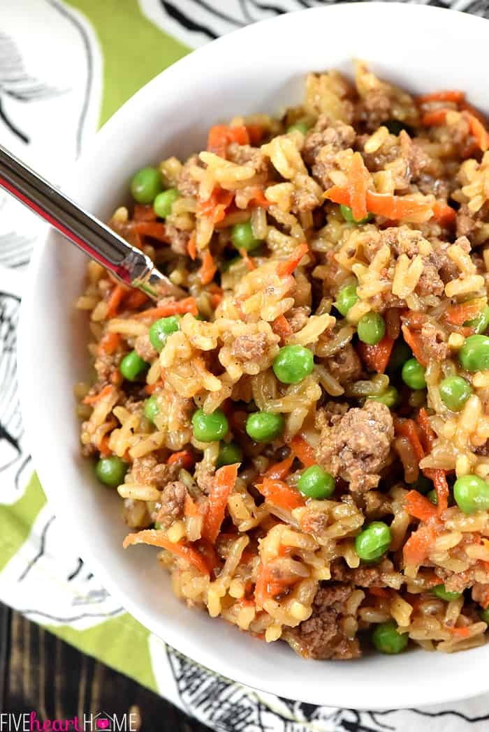 One-Pan Asian Ground Beef and Rice Recipe ~ a quick and easy dinner skillet requiring a simple list of all-natural ingredients, only one pan, and under 30 minutes to make from start to finish! {Hamburger Helper Rice Oriental copycat recipe} | FiveHeartHome.com Aerial close-up of serving in a bowl with spoon.