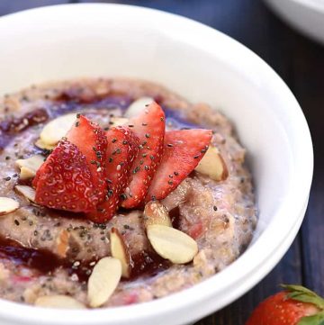 Healthy Strawberries & Cream Oatmeal ~ an easy, wholesome breakfast recipe for busy mornings, topped with toasted almonds and chia seeds to make it extra tasty and nutritious! | FiveHeartHome.com