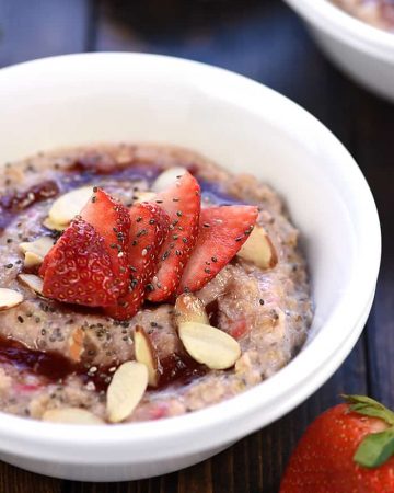 Healthy Strawberries & Cream Oatmeal ~ an easy, wholesome breakfast recipe for busy mornings, topped with toasted almonds and chia seeds to make it extra tasty and nutritious! | FiveHeartHome.com