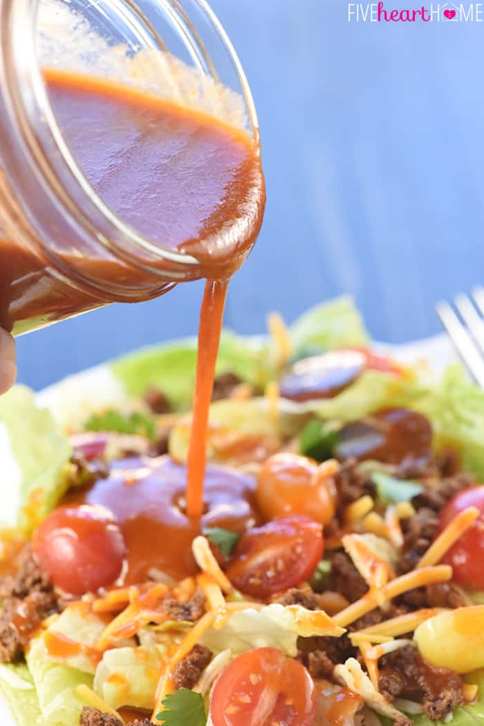 Catalina Dressing being poured over a salad.