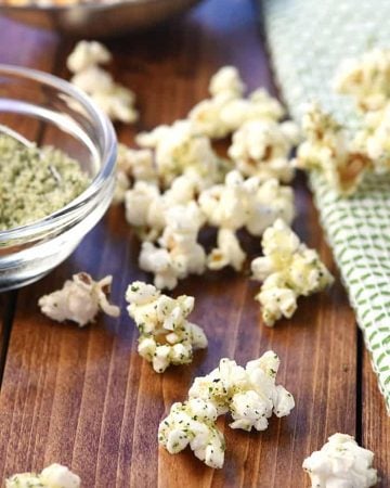 Parmesan Ranch Popcorn scattered on tablel.