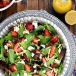 Aerial view of Easter Salad in serving bowl with strawberries and lemon dressing.
