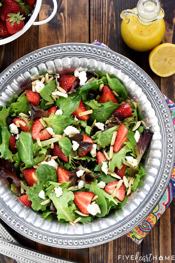 Aerial view of Easter Salad in serving bowl with Lemon Vinaigrette on table.