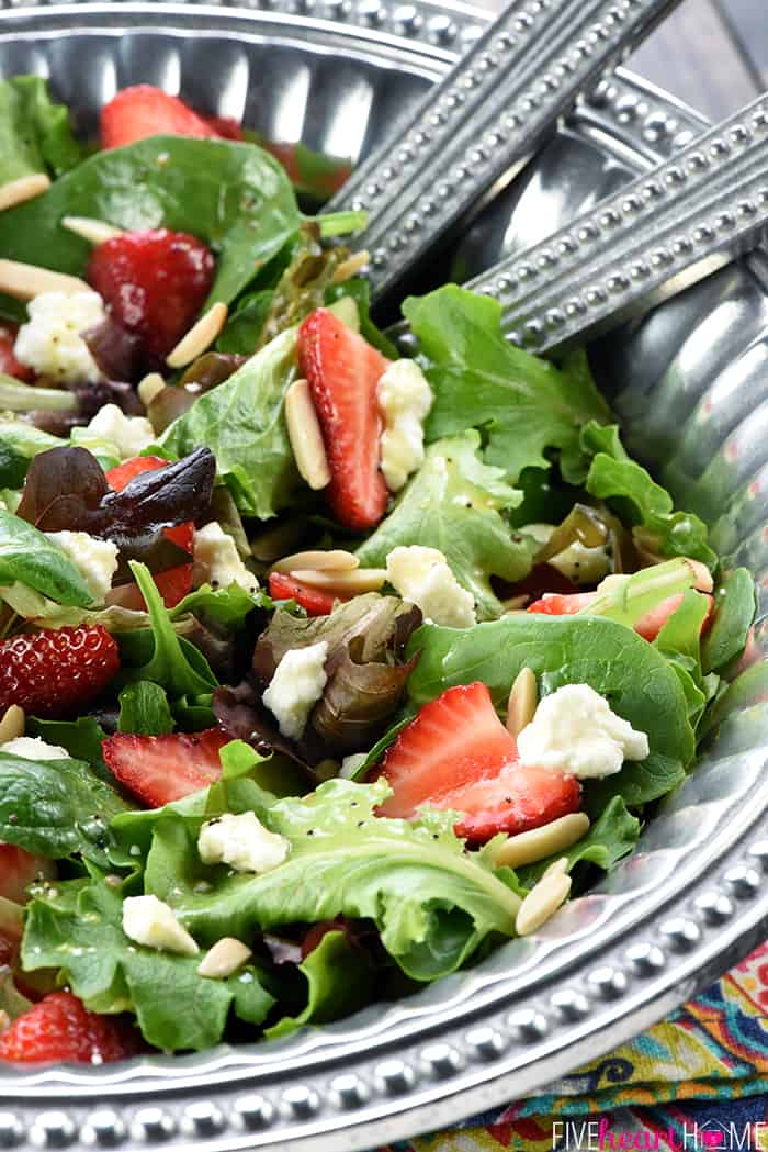 Easter Salad in pewter serving bowl with serving spoons.