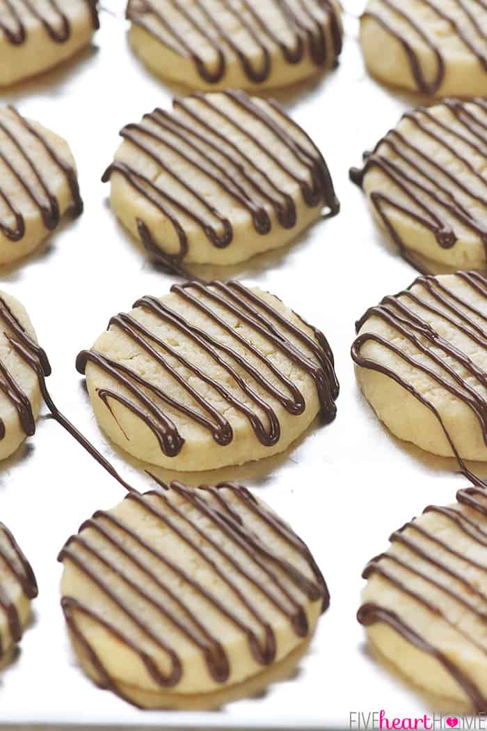 Easy Coconut Shortbread Cookies ~ tender, buttery shortbread is loaded with toasted coconut in this delicious, addictive, easy-to-make recipe! | FiveHeartHome.com Easy Coconut Shortbread Cookies Drizzled with Chocolate
