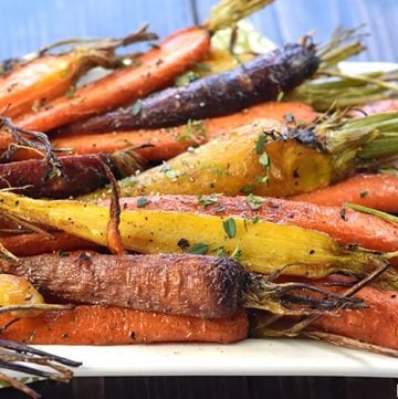 Roasted Rainbow Carrots with Thyme ~ tender and flavorful carrots make a rustic yet vibrant spring or Easter side dish that's as gorgeous as it is delicious! | FiveHeartHome.com
