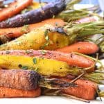 Roasted Rainbow Carrots with Thyme ~ tender and flavorful carrots make a rustic yet vibrant spring or Easter side dish that's as gorgeous as it is delicious! | FiveHeartHome.com