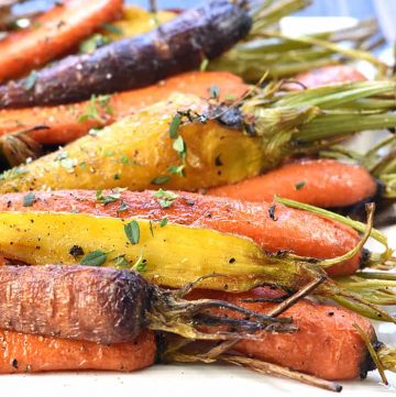 Roasted Rainbow Carrots with Thyme ~ tender and flavorful carrots make a rustic yet vibrant spring or Easter side dish that's as gorgeous as it is delicious! | FiveHeartHome.com