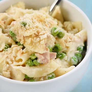 Stovetop Tuna Noodle Casserole Skillet ~ a quick and easy, comforting dinner recipe loaded with tuna, egg noodles, peas, and a creamy, cheesy, from-scratch white sauce! | FiveHeartHome.com