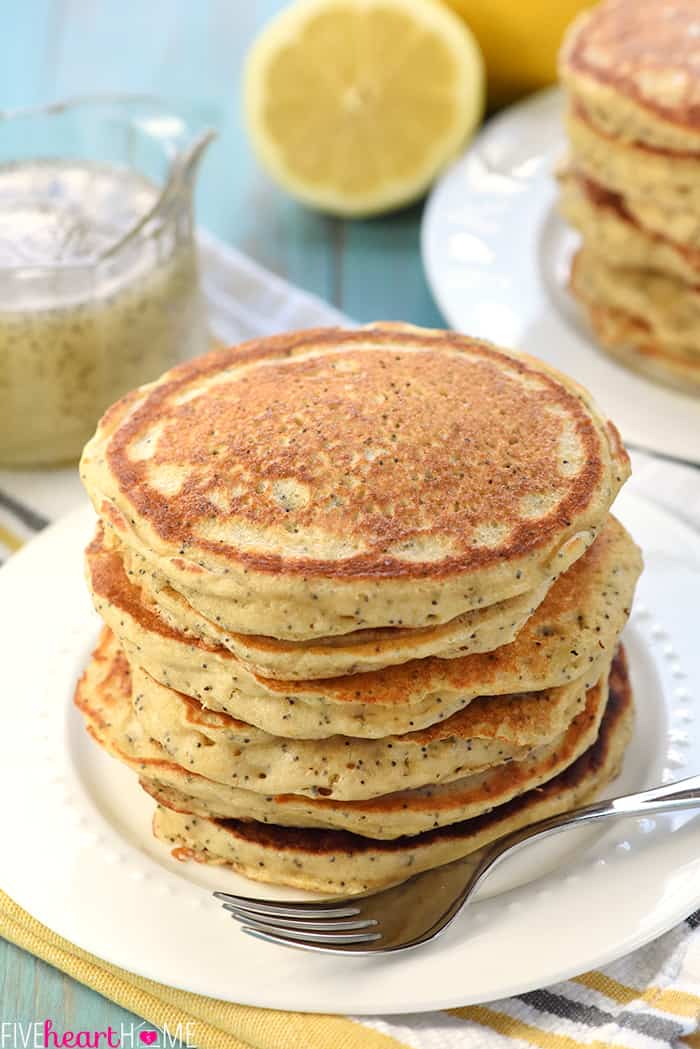 Whole Wheat Lemon Poppy Seed Pancakes ~ wholesome and delicious pancakes drizzled with a scrumptious Lemon Poppy Seed Syrup make a lovely spring or summer breakfast! | FiveHeartHome.com Lemon Pancakes without Syrup on White Plate