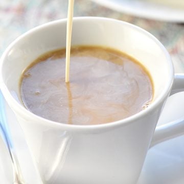 Caramel Brulée Coffee Creamer being poured into cup of coffee.