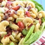 BLT Caesar Pasta Salad with Avocado ~ loaded with crispy bacon, juicy tomatoes, creamy avocado, and tender pasta dressed in tangy Caesar dressing and served atop a bed of fresh lettuce! | FiveHeartHome.com