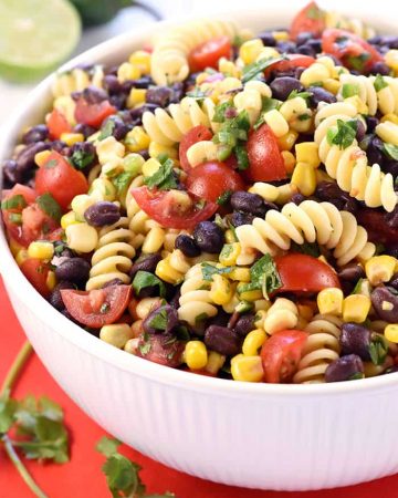 Fiesta Pasta Salad ~ loaded with corn, black beans, tomatoes, jalapeño, cilantro, and a fresh lime vinaigrette for a zesty, flavorful, summer side dish! | FiveHeartHome.com