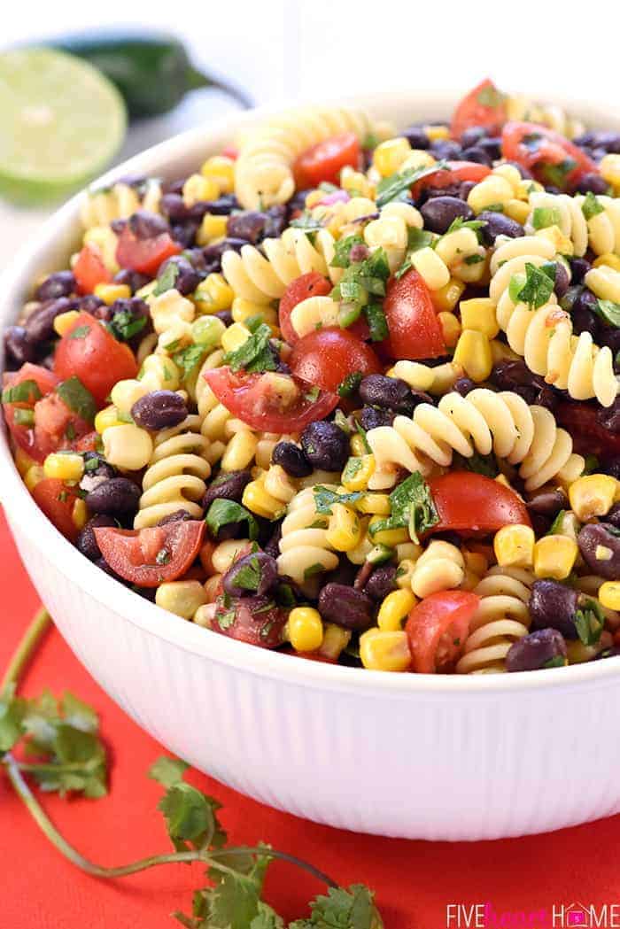 Close-up of Mexican Pasta Salad in white serving bowl.